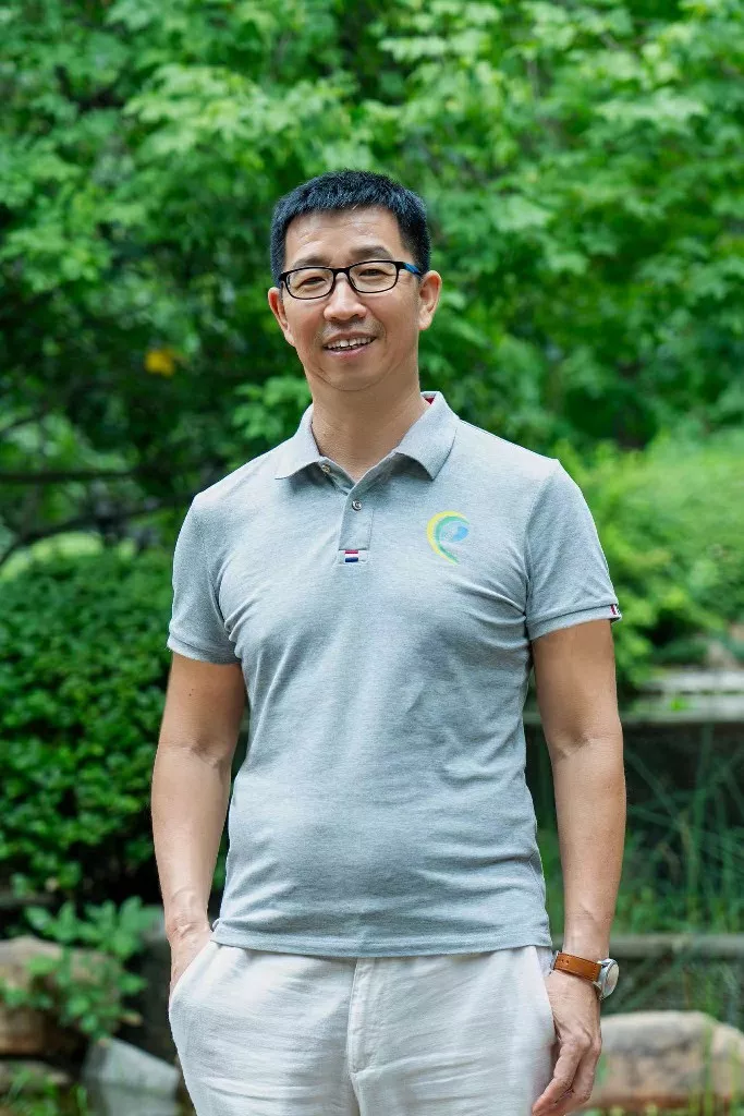 Tom Xiaojun Wang